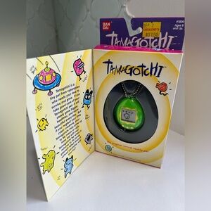 Tamagotchi virtual pet Green/Yellow Bandai 1997 New In Box Vintage